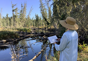 Bev Sketching in Prince Albert National Park, photo by Bonnie Conly